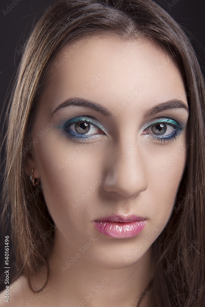 close-up portrait of girl with cocktail makeup on a black isolated background close-up portrait of girl with cocktail makeup on a black isolated background