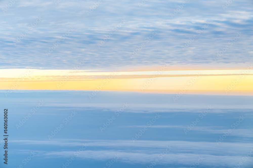 Fototapeta premium View sunset with sky and cloudy from airplane window when flying,Nature background