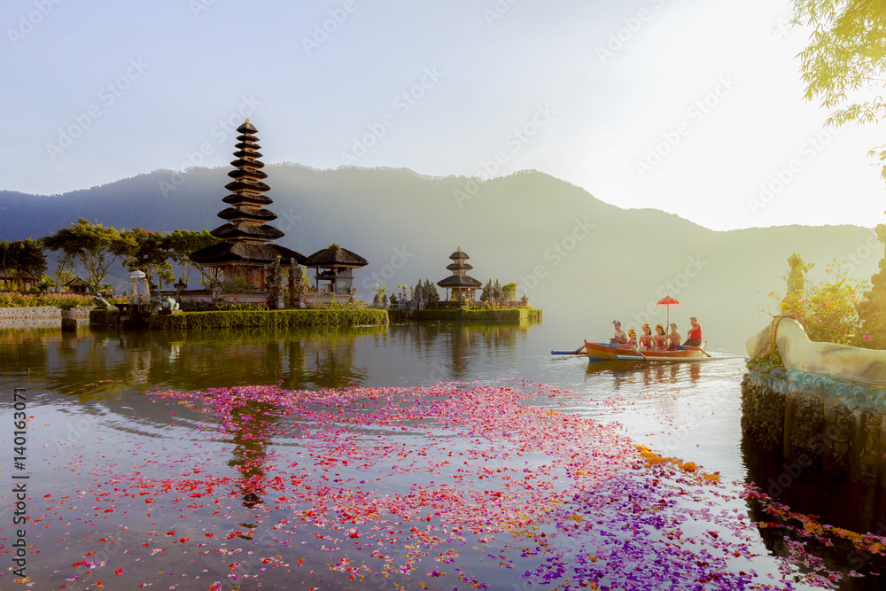 Fototapeta premium Beratan Lake in Bali Indonesia, 6 March 2017 : Balinese villagers participating in traditional religious Hindu procession in Ulun Danu temple Beratan Lake in Bali Indonesia