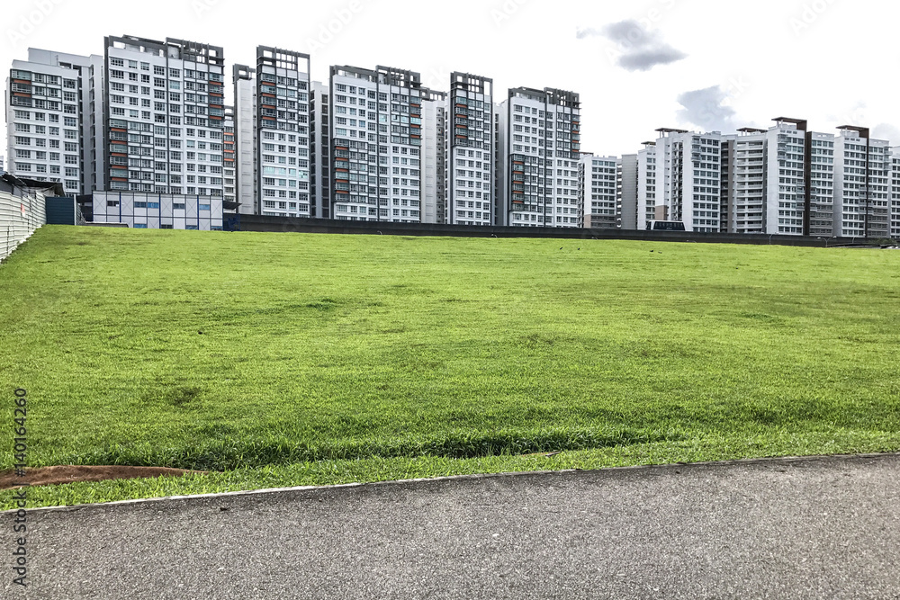 condominiuns on green grass field condominiuns on green grass field