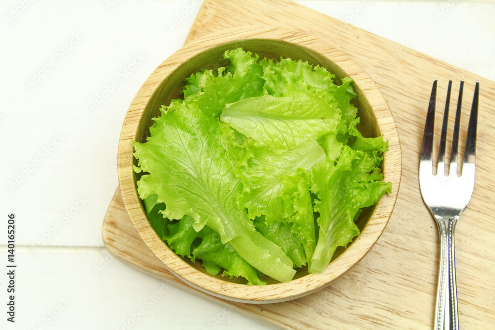Salad leaf. Lettuce isolated on wooden background Salad leaf. Lettuce isolated on wooden background