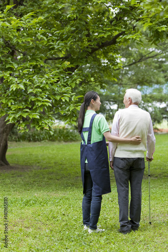 Nurse Walking with Senior Man photo