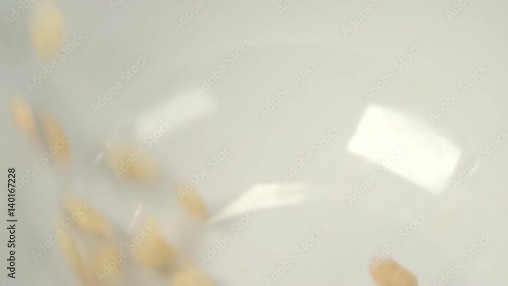 Rice cereal falling in breakfast bowl in slow motion