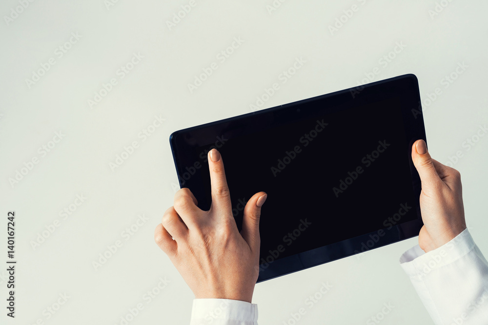 Close of female doctor hands working with tablet pc computer Close of female doctor hands working with tablet pc computer