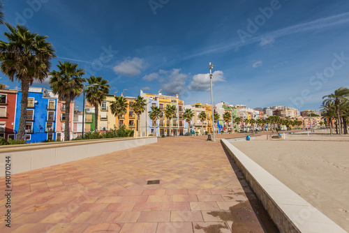 Promenade and beach in colorful village of Villajoyosa in Spain