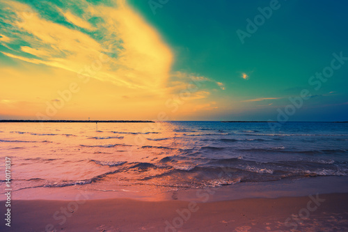 Early morning  sunrise over sea. Blue pink beautiful sunrise. Twilight time on the beach. 