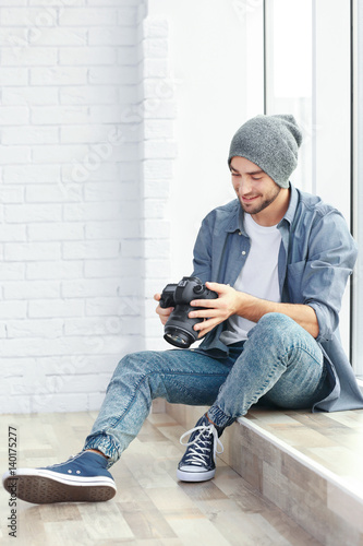 Handsome young photographer...