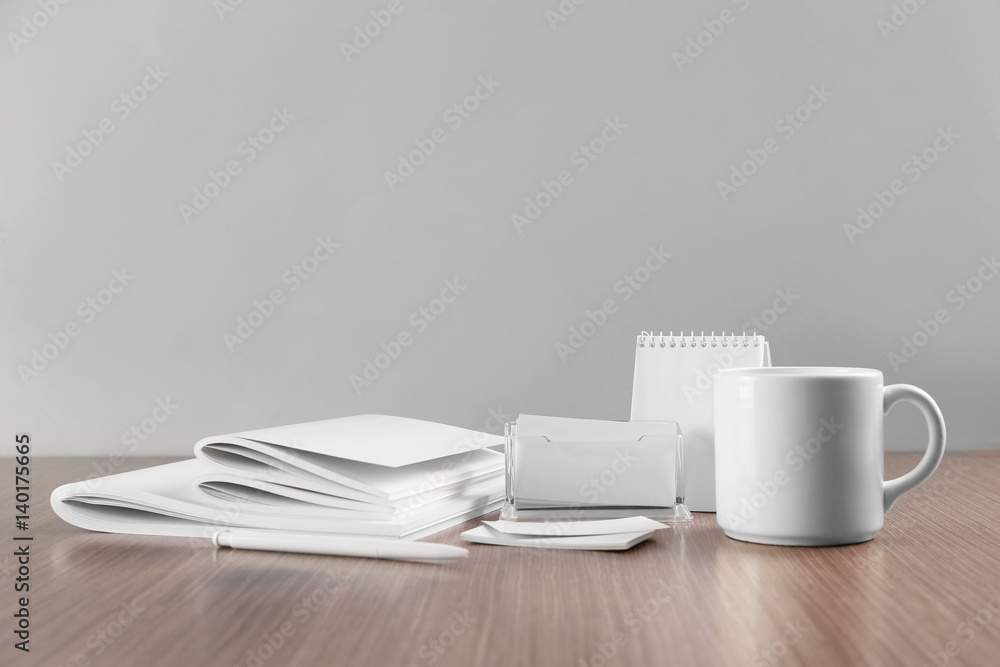 Blank goods on wooden table and grey background Blank goods on wooden table and grey background