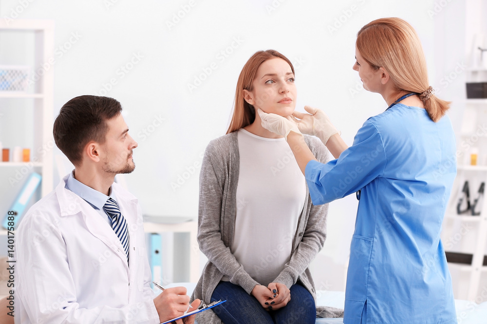 Fototapeta premium Beautiful young woman at doctor's office