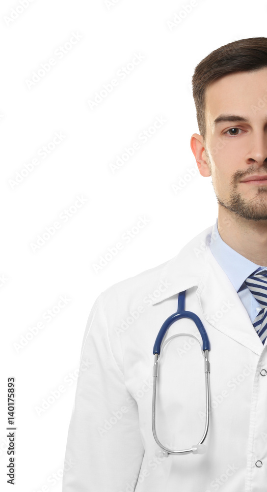 Handsome young doctor with stethoscope on white background
