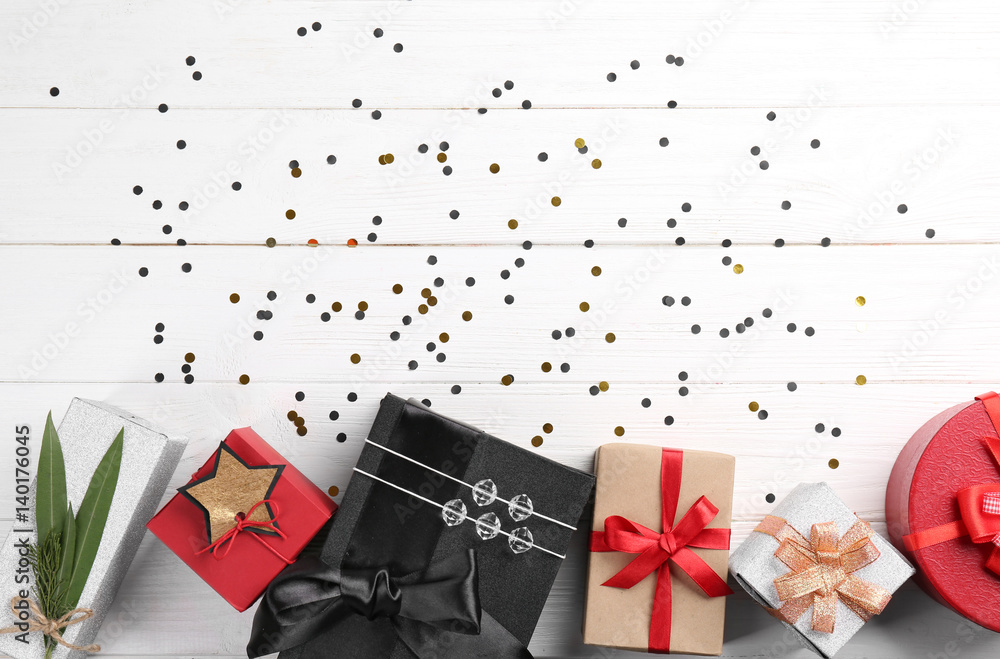 Fototapeta premium Christmas gift boxes on wooden background