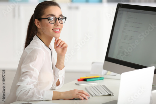 Young woman working at office