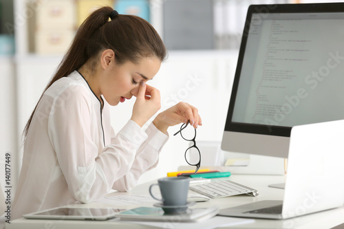 Young woman working at office
