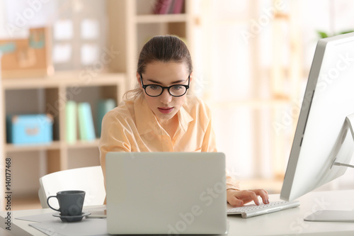Young woman working at office