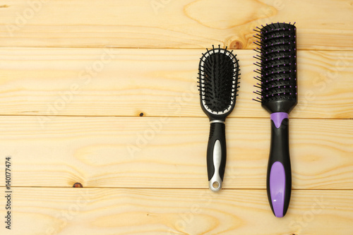 combs for hair on wood background