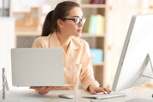 Young woman working at office