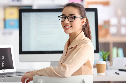 Woman programmer working at...