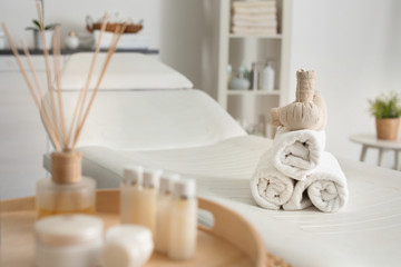 Foto auf Acrylglas Massagesalon Towels with herbal bags in spa center  © Africa Studio