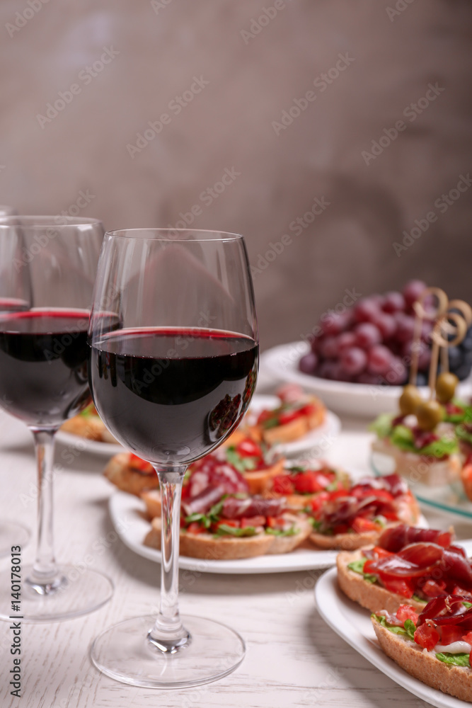 Wine with tasty bruschetta served on table Wine with tasty bruschetta served on table