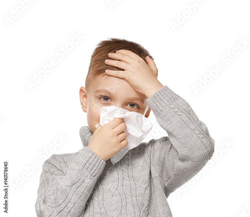 Cute little boy blowing his...