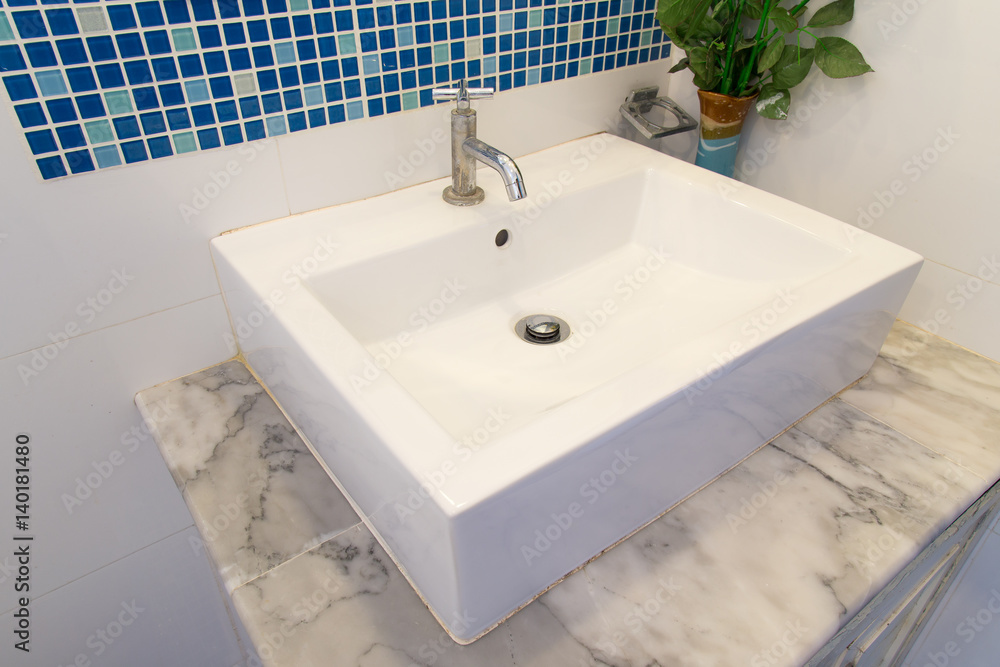 Fototapeta premium Bathroom interior with white sink and faucet.