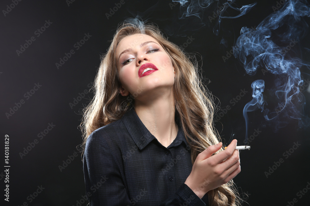 Portrait of beautiful woman with cigarette on black background Portrait of beautiful woman with cigarette on black background
