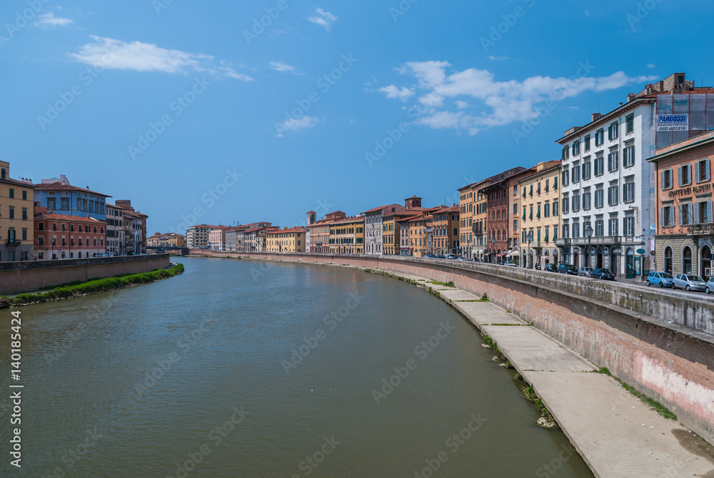 Colorful Italian buildings on the bank of the river Arno in Pisa