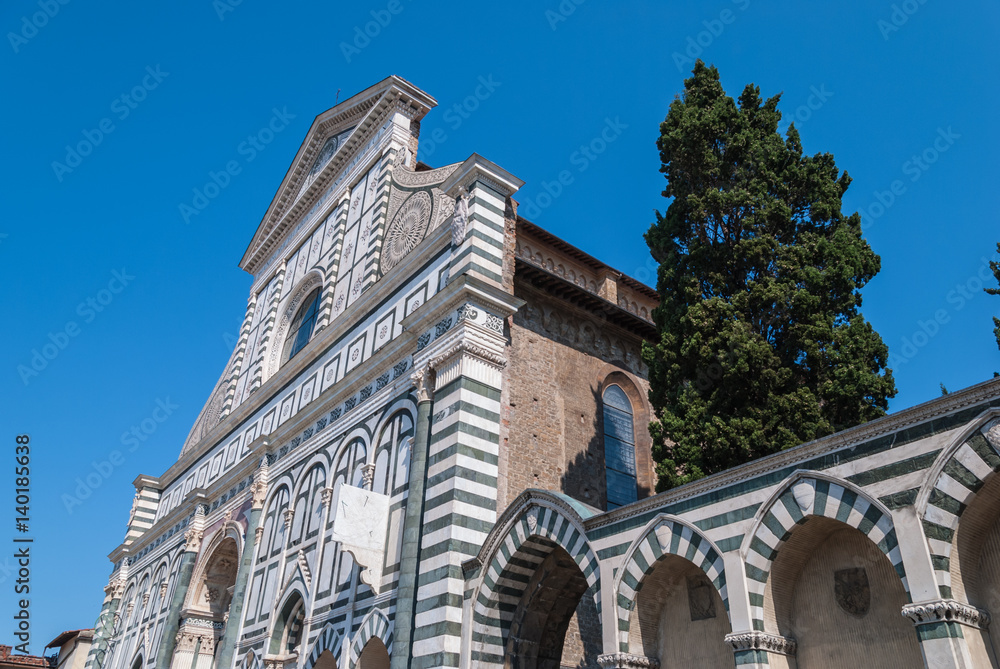 Cathedral in tuscany with ornamental white and green marble facade