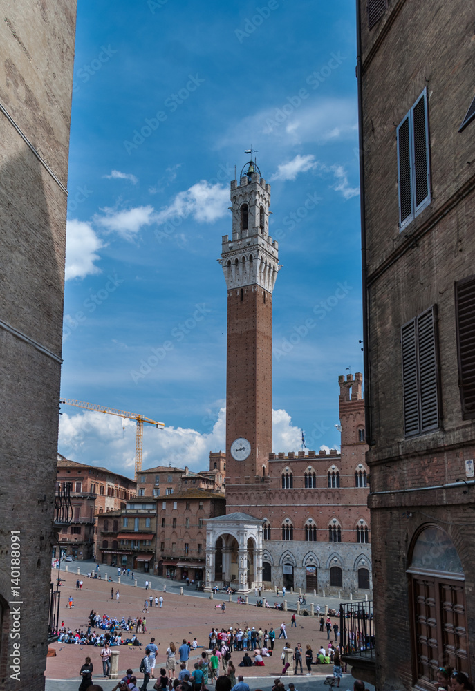 Piazza del Campo, Sienna, Italy viewed between two buildings