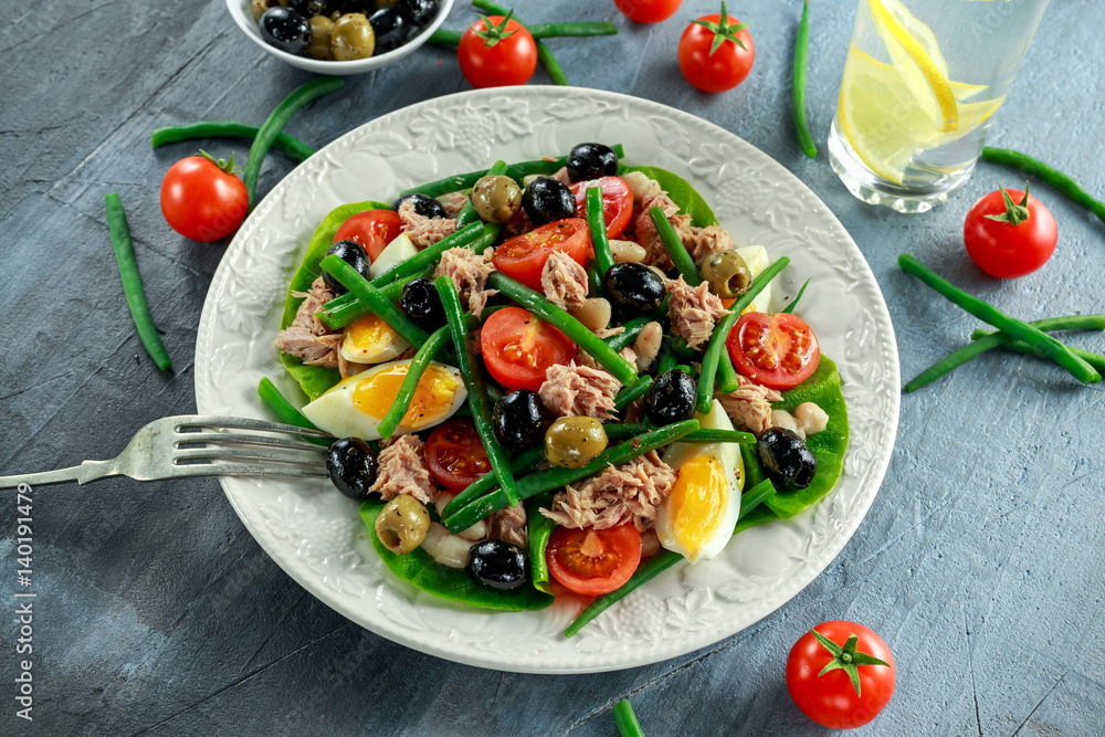 Fresh Tuna Green Bean salad with eggs, tomatoes, beans, olives on white plate. concept healthy food Fresh Tuna Green Bean salad with eggs, tomatoes, beans, olives on white plate. concept healthy food