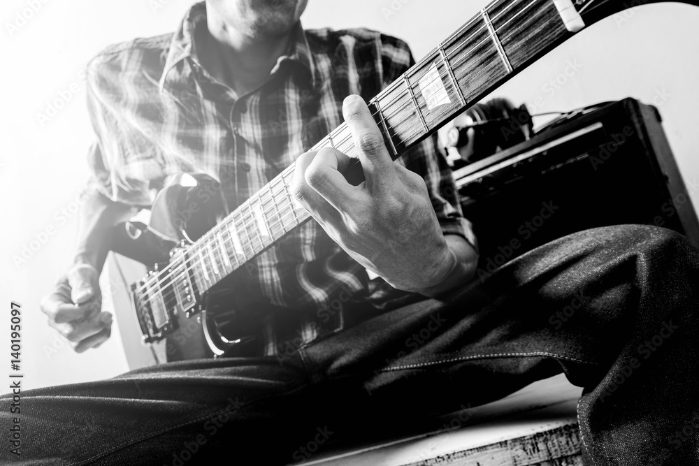 Obraz premium The man playing electric guitar, Black and white
