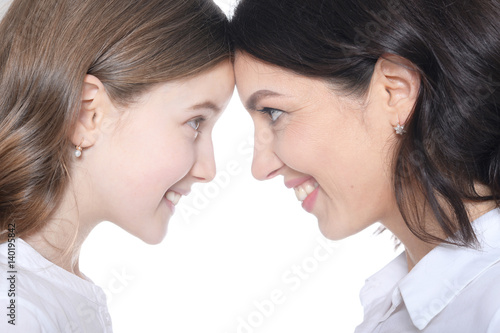 Happy mother with her daughter on a white background