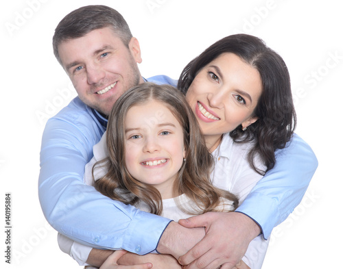 Happy young family on a white background