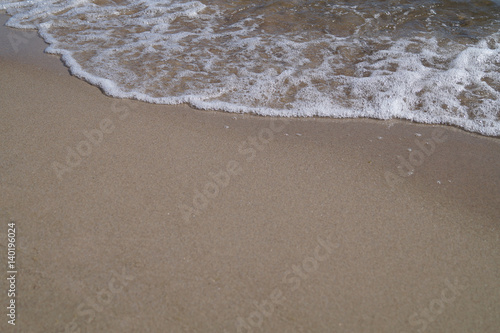 Soft wave of the ocean on the sandy beach