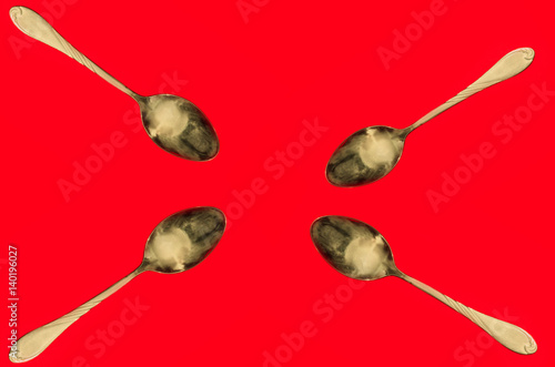 spoons on a red background