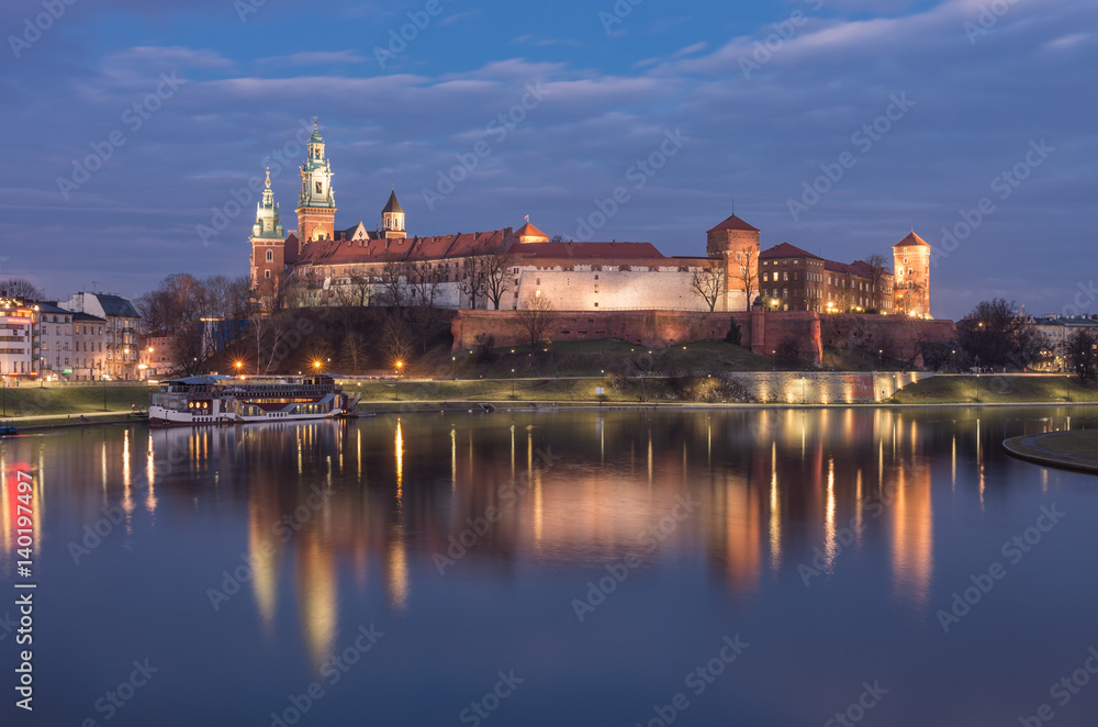 Krakow, Poland, Wawel Castle and Wawel cathedral over Vistula river in the night