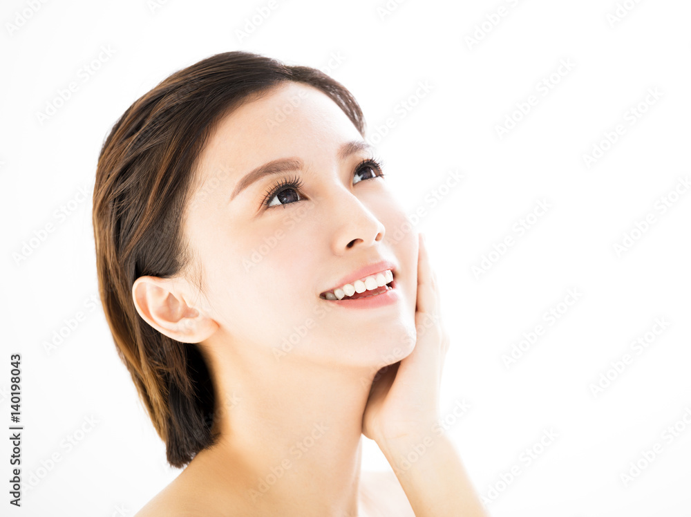 closeup   young  smiling woman face isolated on white