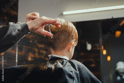 Little Boy Getting Haircut By Barber 