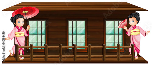 Two japanese girls at wooden hut