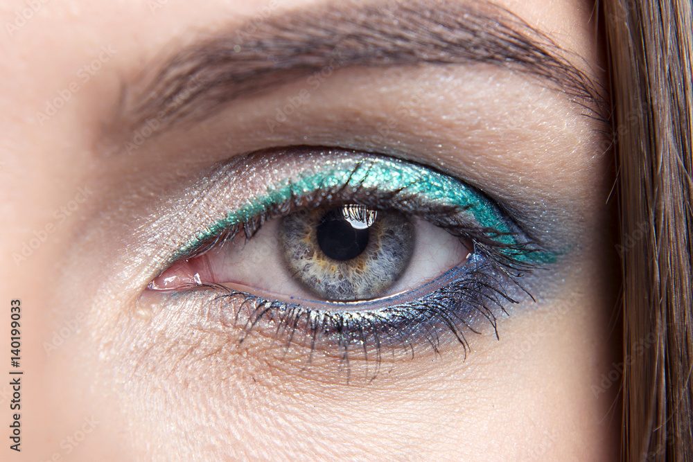 Fototapeta premium bright makeup in the open eye girls with clean skin. Three colors. Macro.