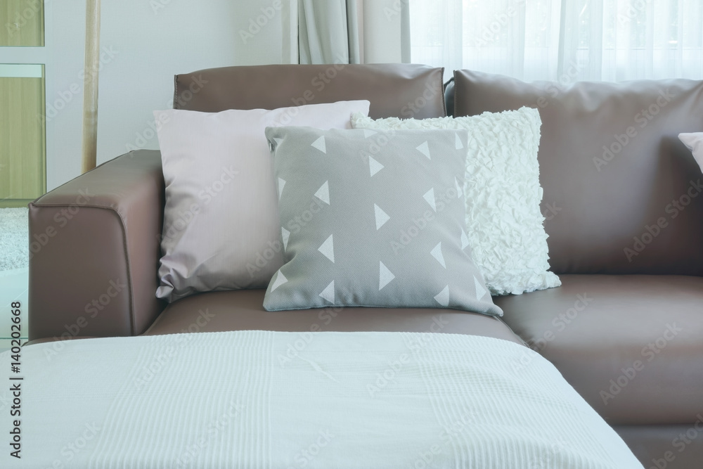 Obraz premium Close up pillows on brown sofa in the living room
