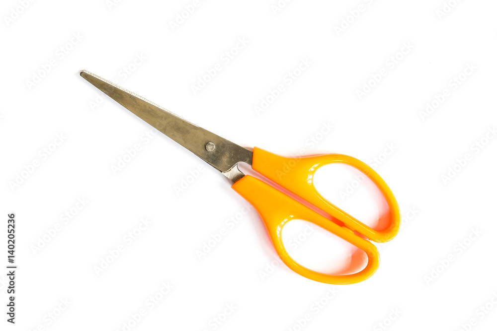 close-up of orange scissors on white background close-up of orange scissors on white background