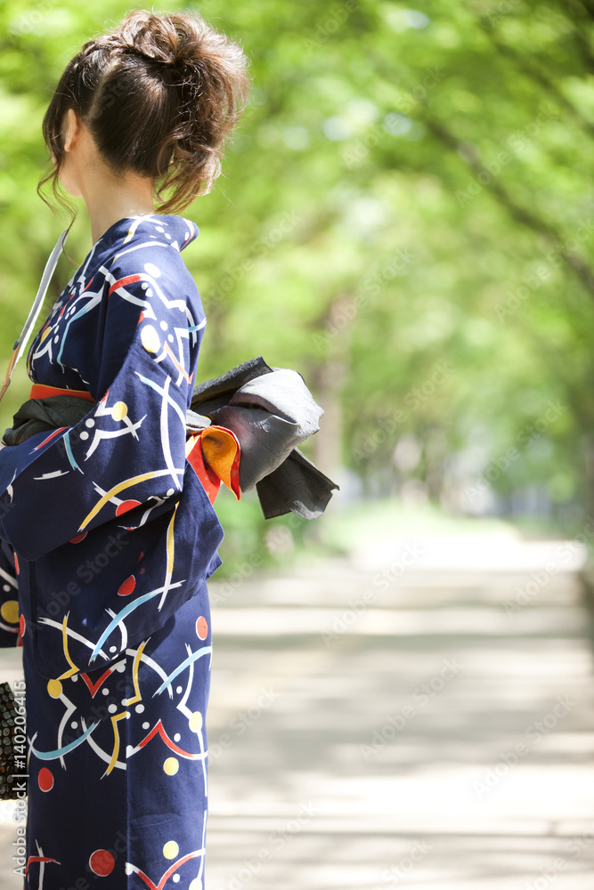 Side view of a young woman wearing Yukata Stock Photo | Adobe Stock