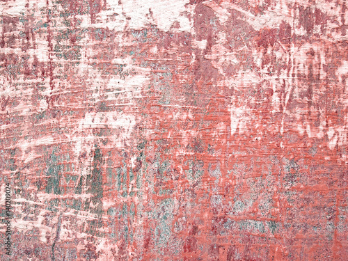Grunge texture of a dilapidated wall in a red tone