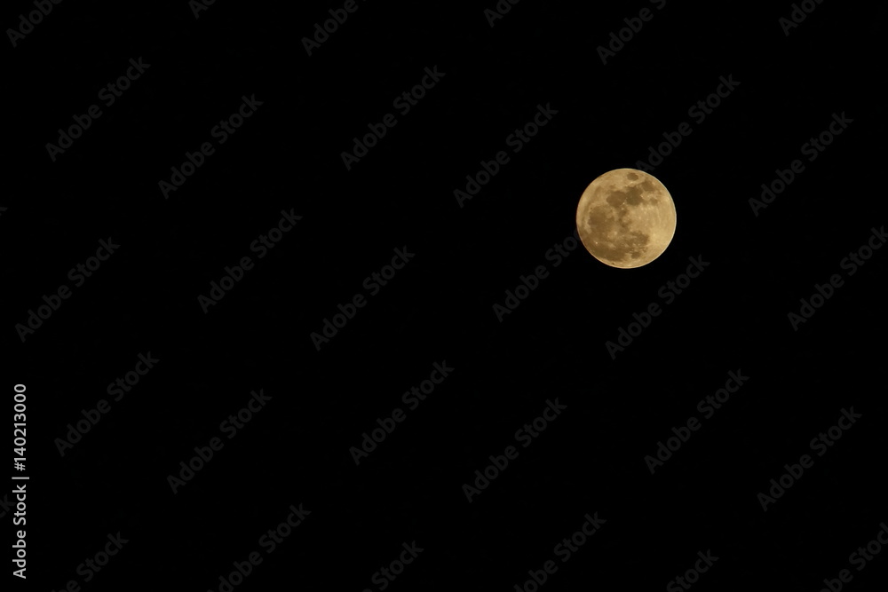 The full moon, super moon in the dark night. Soft focus with low key. The full moon, super moon in the dark night. Soft focus with low key.
