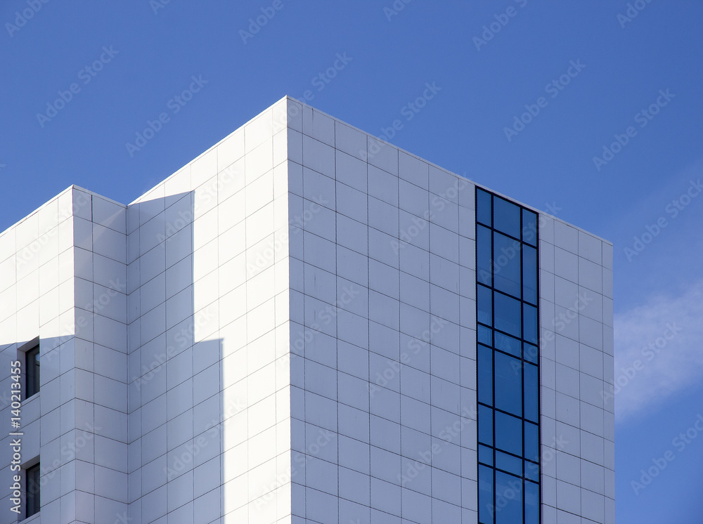 High-rise office building against blue sky High-rise office building against blue sky