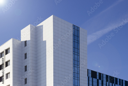 Wallpaper Mural High-rise glass building against blue sky Torontodigital.ca