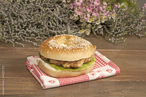A chicken sandwich on a bagel