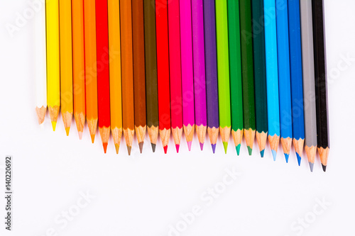 Colored pencils pattern isolated on white background
