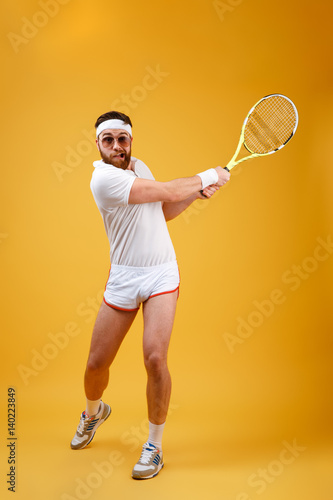 Vertical image of sportsman playing in tennis © Drobot Dean